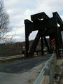 Another view of west end of bridge. Those 8 white dots on the upper deck appear to be missing rivets.