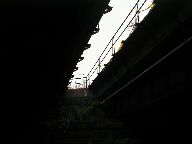Looking up between spans, toward railroad west. Note two-pipe railing.