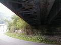 View of underside of railroad bridge just east of Colliers. View looks toward railroad west end of bridge; Road west is to the left. (40.36716N 80.52554W)